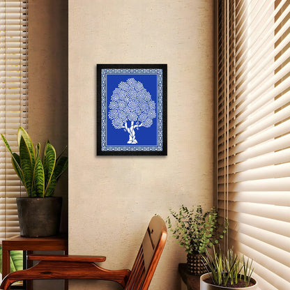 A framed blue Warli Art painting of a tree by DSF Wall Art.